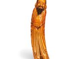 une image représentant une statue en bois d'un homme barbu