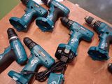 a lot of electric tools that are on a table