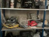many tools on the shelves in the garage