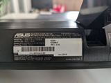a label on the back of a laptop that says asus