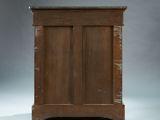 an old wooden cabinet with two doors and a drawer underneath it