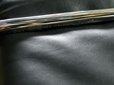 an image of a close up of a wrench on a black leather chair