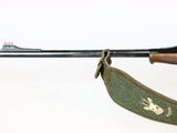 a rifle with a sling attached to it on a white background