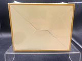 clear acrylic acrylic display stand with a yellow envelope on it