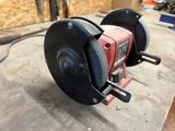 a picture of a circular grinder sitting on a workbench