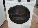 a white washing machine sitting on the floor next to a white washing machine