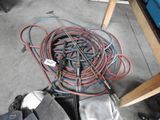 a lot of wires and tools on the floor