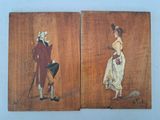 deux tableaux représentant un homme et une femme, peints sur un panneau de bois