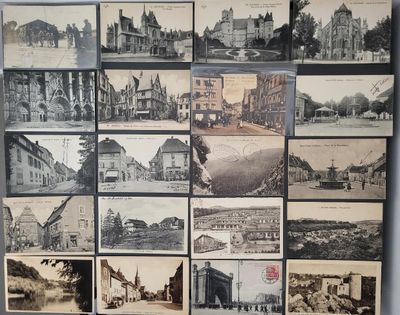 many pictures of old buildings on display on the wall