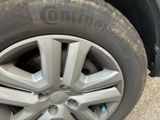 a close up of a tire on a car ' s rim