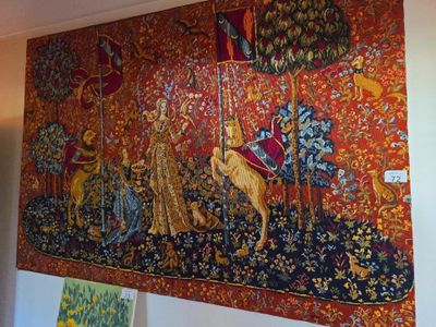 a tapestry hanging on the wall of a room