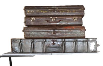 three suitcases stacked on top of each other on a table