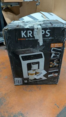 a box that is sitting on a table with a coffee maker