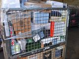 a metal cart with many boxes in it in a warehouse