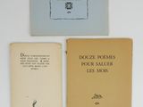 three books sitting on top of a white table next to each other