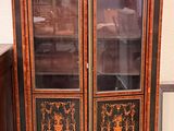 an image of a cabinet with a glass door in a room
