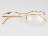 a close up of a pair of glasses on a white surface