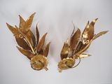 pair of gold plated wall sconces with flowers and leaves