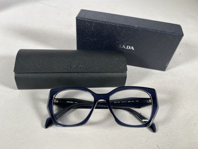 a pair of glasses sitting on top of a table next to a box