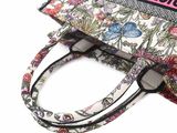 a purse that has a name tag on it