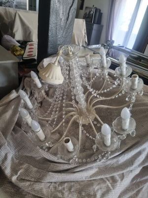 a chandelier that is sitting on a table in a living room