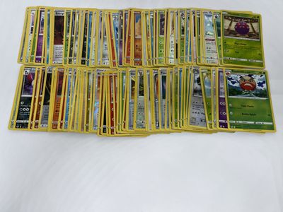 a lot of pokemon cards on the table