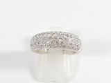 a close up of a diamond ring on a white surface