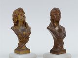 pair of bronze busts of a woman and a man on marble bases