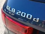 a close up of a blue car with the word glb 2000 on it