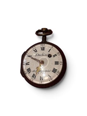 a clock that has roman numerals on the face of it