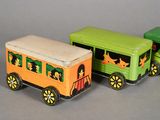 three toy trains that are sitting next to each other