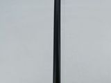 a tall pole with a clock on it in the middle of the water