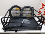 two bikes that are sitting on top of a table