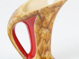 a vase with a red handle on a white background