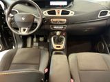 the interior of a small car with a steering wheel and dashboard