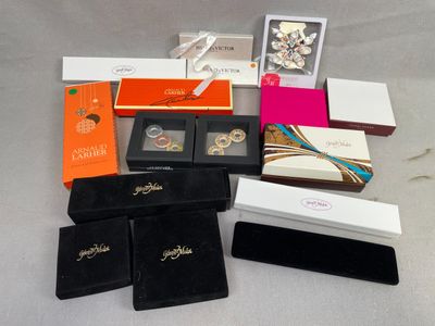 many different types of jewelry boxes on the table
