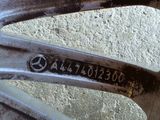 a close up of a wheel with a mercedes logo on it