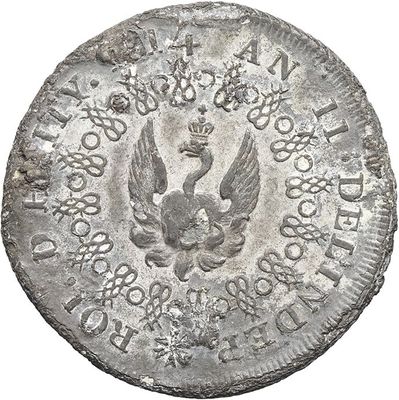 an old silver coin with a bird on it