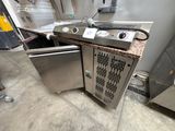 a kitchen with a stove, oven, and other appliances in it