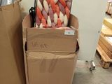 two boxes with carrots in them sitting on a carton