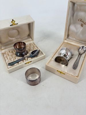 two silverware items in a wooden box on a table