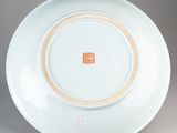 chinese blue and white porcelain plate with a red and white design