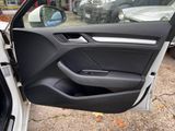 the door of a car is open with the driver ' s side door open