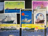a lot of stamps that are on the table