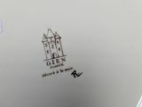 an image of a white plate with a castle on it