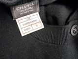 chanel sweater label on the back of a black sweater