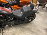 a black and red motorcycle parked in a garage