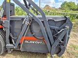 a close up of a fork attachment attached to the back of a tractor