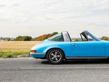 an image of a blue car parked on the side of the road