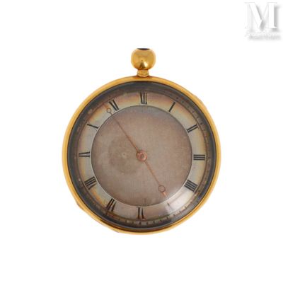 une montre de poche en or avec des chiffres romains sur le cadran